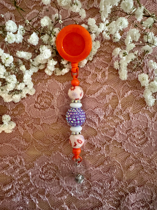 Orange with Purple Badge Reel